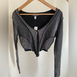 Sparkly black long sleeve crop top from Urban Outfitters.